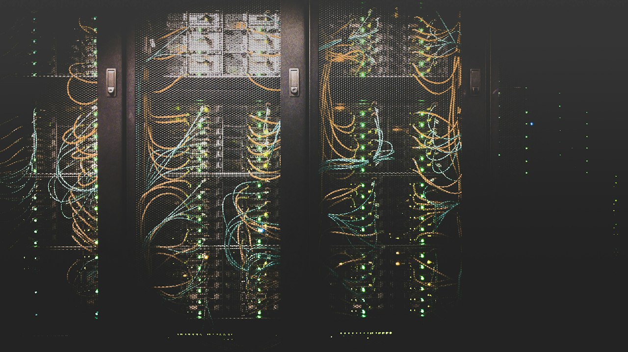 Equipment cabinets and cabling inside a server room (illustrative stock photo)
