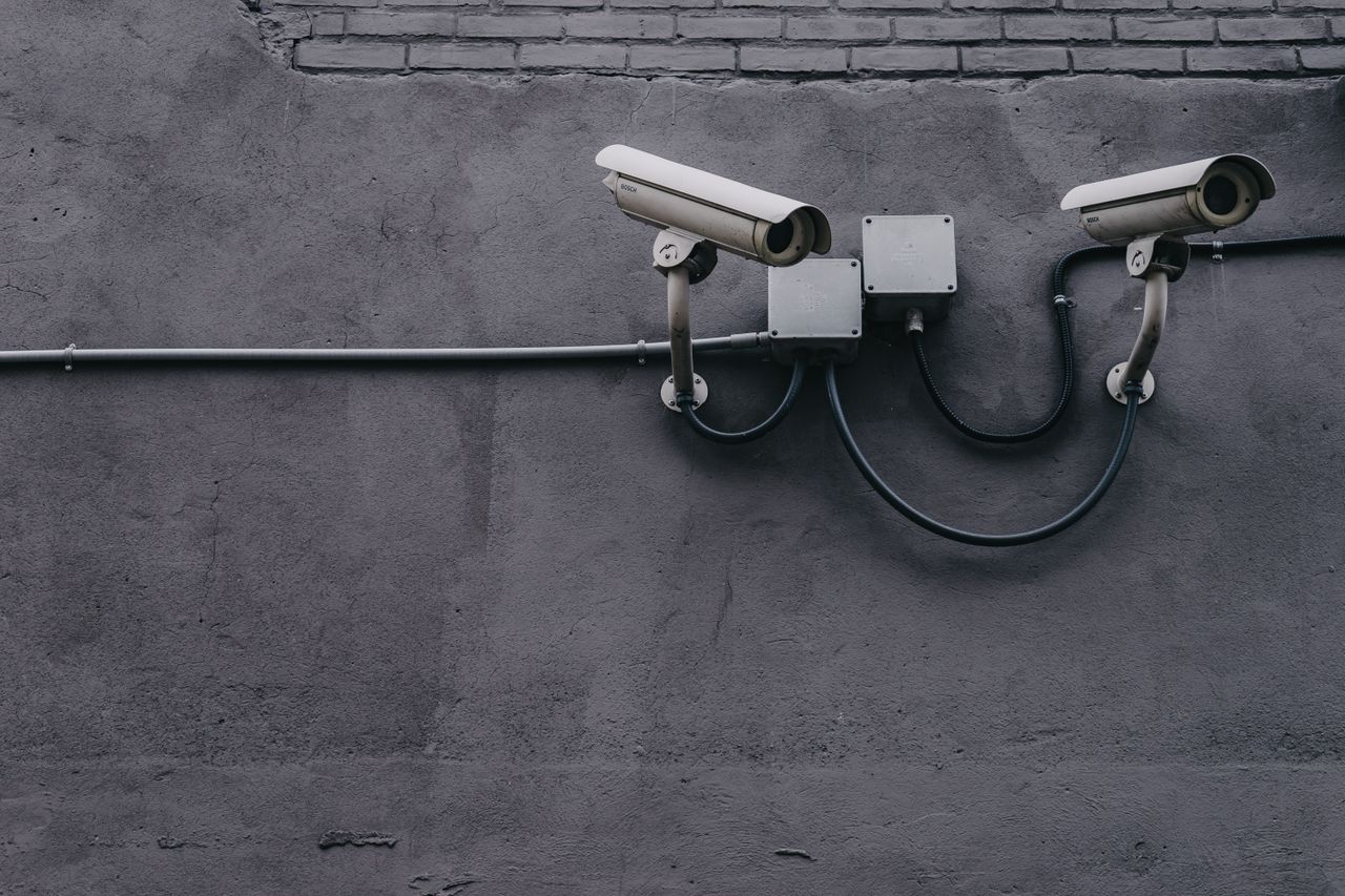 Building-mounted security cameras (illustrative stock photo)